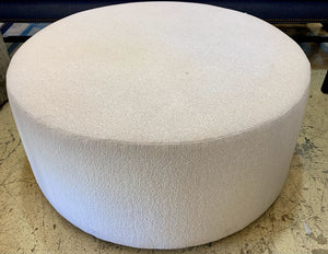 Round Upholstered Ottoman in Cream